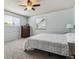 Comfortable bedroom featuring a large bed, soft lighting, and ample closet space at 7724 S Lafayette Ct, Centennial, CO 80122