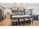 Modern kitchen featuring a large island, stainless steel appliances, and hardwood floors at 7724 S Lafayette Ct, Centennial, CO 80122