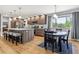 Open kitchen and dining area with a large island, stainless appliances, and ample cabinet space at 7724 S Lafayette Ct, Centennial, CO 80122