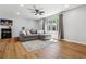 Inviting living room with hardwood floors, natural lighting, and comfortable sectional couch at 7724 S Lafayette Ct, Centennial, CO 80122