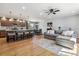 Open concept living room and kitchen area with hardwood floors and natural light at 7724 S Lafayette Ct, Centennial, CO 80122