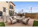 Backyard features a stone fire pit and comfortable seating, perfect for outdoor entertaining at 5 Harrison St, Denver, CO 80206