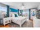 Bright and airy bedroom with city views, decorative bedside tables, and plush carpet at 5 Harrison St, Denver, CO 80206