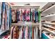 Walk-in closet featuring ample storage with shelving and hanging racks for organized apparel and shoes at 5 Harrison St, Denver, CO 80206