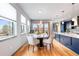 Bright dining area with modern lighting, hardwood floors, and a view; perfect for Gathering meals and entertaining at 5 Harrison St, Denver, CO 80206