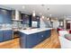 Stylish kitchen with stainless steel appliances, mosaic backsplash, and a large island; perfect for cooking and entertaining at 5 Harrison St, Denver, CO 80206