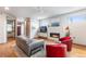 Inviting living room with a fireplace, recessed lights and comfortable seating; ideal for unwinding and enjoying time at home at 5 Harrison St, Denver, CO 80206