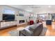 Well-lit living room featuring a cozy fireplace, stylish furnishings, and large windows; great for relaxing and entertaining at 5 Harrison St, Denver, CO 80206