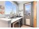 Mud Room with sleek cabinets, stainless drink cooler, stylish fixtures, large window, and a secure pet door at 5 Harrison St, Denver, CO 80206