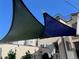 Outdoor view of green and blue shade sails providing shade on a rooftop patio or deck, enhancing outdoor living at 5 Harrison St, Denver, CO 80206