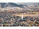 Scenic aerial view of a home nestled in a neighborhood with majestic mountain views at 6290 Virgil St, Arvada, CO 80403