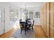 Bright dining area with natural light, a modern light fixture, and views of the backyard at 6290 Virgil St, Arvada, CO 80403