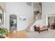 Bright and open foyer featuring high ceilings and elegant staircase at 6290 Virgil St, Arvada, CO 80403