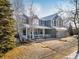 Inviting two-story home showcasing a charming front porch and meticulously maintained landscaping at 6290 Virgil St, Arvada, CO 80403