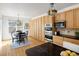 Kitchen area with a large number of cabinets and dining area at 6290 Virgil St, Arvada, CO 80403