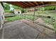 Spacious backyard with a covered patio, shed, trampoline, and a brick-lined garden area at 3246 S Nucla St, Aurora, CO 80013