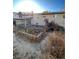 Backyard view showing home's back elevation and needs landscaping at 3246 S Nucla St, Aurora, CO 80013