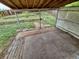 Covered back patio looking out on a multi-level yard with garden beds and wood fence at 3246 S Nucla St, Aurora, CO 80013