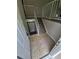 View of an entryway with tile flooring and carpeted stairs at 3246 S Nucla St, Aurora, CO 80013