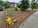 Modest two-story brick home with a lawn, trees, driveway, and bright yellow fire hydrant at 3246 S Nucla St, Aurora, CO 80013