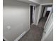 Hallway with neutral paint and carpet with doors to rooms at 3246 S Nucla St, Aurora, CO 80013