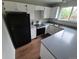 A modern kitchen features white cabinetry, stainless steel appliances, and ample counter space for food preparation at 3246 S Nucla St, Aurora, CO 80013