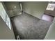 An expansive living area with neutral carpet and railing overlooking the space, great for entertaining and relaxing at 3246 S Nucla St, Aurora, CO 80013