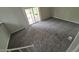 Spacious living room with neutral carpeting and sliding glass doors to the outside deck for natural light and access at 3246 S Nucla St, Aurora, CO 80013