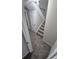 Carpeted staircase with white railings leading to the next level of the home at 3246 S Nucla St, Aurora, CO 80013