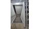 View looking down a gray-carpeted staircase, with white railings and gray walls at 3246 S Nucla St, Aurora, CO 80013