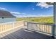 View from the back deck overlooking new construction homes and open field with a clear blue sky at 39628 Yorktown Ter, Elizabeth, CO 80107