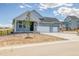 Beautifully designed home showcasing a well-manicured front yard and inviting entrance at 39628 Yorktown Ter, Elizabeth, CO 80107
