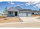 Charming single Gathering home with a 3 car garage, professional landscaping, and a covered front porch at 39628 Yorktown Ter, Elizabeth, CO 80107
