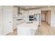 Contemporary kitchen with stainless steel appliances, an island, and ample cabinet space at 39628 Yorktown Ter, Elizabeth, CO 80107