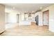 Spacious open layout featuring modern kitchen flowing into a bright living area at 39628 Yorktown Ter, Elizabeth, CO 80107