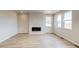 Living room with a modern fireplace and windows; perfect for cozy evenings at 39628 Yorktown Ter, Elizabeth, CO 80107