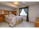 Relaxing bedroom featuring a comfortable bed, built-in storage, and soft lighting at 698 Larimer Creek Dr, Monument, CO 80132