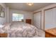 Comfortable bedroom with a cozy bed, ample closet space and natural light at 698 Larimer Creek Dr, Monument, CO 80132