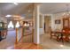 Open-concept living room and dining area with hardwood floors and natural light at 698 Larimer Creek Dr, Monument, CO 80132
