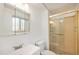 Clean bathroom featuring a glass enclosed shower and vanity with a mirrored cabinet at 1533 S Jamaica St, Aurora, CO 80012