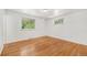 Bright bedroom featuring hardwood floors and sunlit windows at 1533 S Jamaica St, Aurora, CO 80012