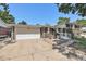 Charming brick home featuring an attached two-car garage and well-kept front yard at 1533 S Jamaica St, Aurora, CO 80012