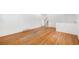 Sunlit living room featuring hardwood floors and bright white walls at 1533 S Jamaica St, Aurora, CO 80012