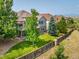 Expansive backyard features tiered decks and lush landscaping at 13943 W 87Th Ln, Arvada, CO 80005