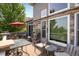 A charming back deck and patio with a beautiful stone house exterior at 13943 W 87Th Ln, Arvada, CO 80005