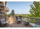 A scenic back deck with seating, a view of water, and open space at 13943 W 87Th Ln, Arvada, CO 80005