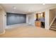 Basement rec room featuring a wet bar area and ample space for entertaining at 13943 W 87Th Ln, Arvada, CO 80005