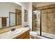 Bathroom featuring a large shower with glass doors, a tiled backsplash, and a modern sink at 13943 W 87Th Ln, Arvada, CO 80005