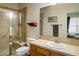 Well-maintained bathroom featuring a glass door shower and single sink vanity at 13943 W 87Th Ln, Arvada, CO 80005