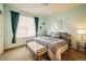 Comfortable bedroom with large window, stylish curtains, and inviting decor at 13943 W 87Th Ln, Arvada, CO 80005